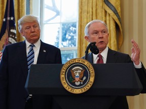In this Feb. 9, 2017, file photo, President Donald Trump listens as Attorney General Jeff Sessions speaks in the Oval Office of the White House in Washington, after Vice President Mike Pence administered the oath of office to Sessions.