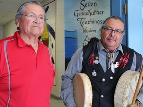 Delbert Riley (left), a long-time First Nations leader and activist from the Chippewas of the Thames, and Chief Myeengun Henry leave the Chippewas of the Thames community centre to go to a demonstration at the Thames River in reaction to the Supreme Court of Canada's decision to allow Enbridge Line 9 to reverse its oil flow. (CHARLIE PINKERTON, The London Free Press)