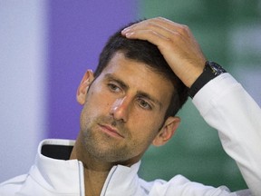 Novak Djokovic will miss the rest of this season because of an injured right elbow. The 12-time major champion will skip the U.S. Open. (AELTC/Joe Toth/File via AP)