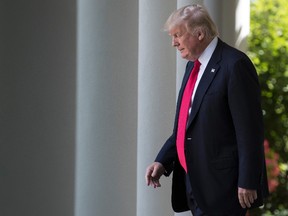 U.S. President Donald Trump arrives in the Rose Garden of the White House in Washington on Wednesday, July 26, 2017. (Carolyn Kaster/AP Photo)