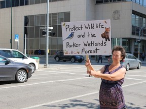 Debbie Belcourt stands in support of protesters who hope to stop clear cutting of the Parker lands on Wednesday, July 26, 2017. A group who support those efforts rallied outside Winnipeg's law courts building that morning as the court set a date to hear an injunction to get protesters off the land. (JOYANNE PURSAGA/Winnipeg Sun/Postmedia Network)