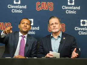 New Cleveland Cavaliers general manager Koby Altman, left, and chairman Dan Gilbert take questions during an NBA basketball news conference at the team's training facility in Independence, Ohio on July 26, 2017. (AP Photo/Phil Long)