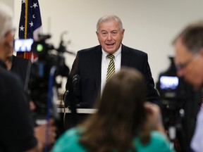 Douglas County Attorney Don Kleine announces during a news conference in Omaha, Neb., Wednesday, July 26, 2017 that two Omaha police officers will be charged with assault in the death of 29-year-old Zachary Bearheels. (AP Photo/Nati Harnik)