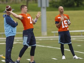 Toronto Argonauts' Jeff Mathews rears back in front of teammate Ricky Ray during a walk-through practice in Toronto on July 26, 2017. (Jack Boland/Toronto Sun/Postmedia Network)