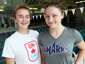 Genevieve Sasseville, left, and Madison Broad of the Chatham Y Pool Sharks won medals at the Canadian junior swimming championships in Toronto on Wednesday, July 26, 2017. (MARK MALONE/The Daily News)