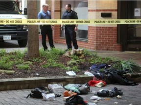 Police investigate a downtown London assault that critically injured a man. Investigators remained on the scene at a courtyard near Dufferin Avenue and Richmond Street on Saturday, Aug. 29, 2015. (Free Press file photo)