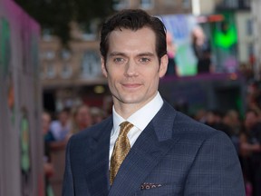 In this Wednesday, Aug. 3, 2016 file photo, actor Henry Cavill poses for photographers upon arrival at the European Premiere of Suicide Squad, at a central London cinema in Leicester Square. Superman will apparently be back in black. "Man of Steel" star Cavill posted a close-up image of a black Superman uniform Monday, Aug. 15, 2016, on Instagram. He's expected to return in next year's "Justice League." (AP Photo/Joel Ryan, File)