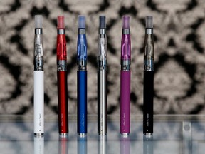 In this April 23, 2014 file photo, E-cigarettes appear on display at Vape store in Chicago. Smokers who used e-cigarettes were more likely to kick the habit than those who didn’t, according to a new study that suggests a liberal approach to the electronic devices could help curb smoking rates. The American study was based on the biggest sample of e-cigarette users to date and attempted to clarify if e-cigarettes help smokers quit. The research was published online Wednesday, July 26, 2017 in the journal, BMJ. (AP Photo/Nam Y. Huh, File)