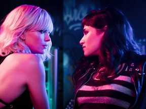 This image released by Focus Features shows Charlize Theron, left, and Sofia Boutella in "Atomic Blonde." (Jonathan Prime/Focus Features via AP)