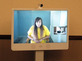 Obdulia Sanchez, 18, appears Wednesday, July 26, 2017, in a Los Banos branch of the Merced County Superior Court via a remote camera from jail in Merced, Calif. Sanchez pleaded not guilty to felony charges of vehicular manslaughter and drunken driving after she lost control of her car while livestreaming on Instagram and recording a crash that killed her younger sister. (AP Photo/Scott Smith)