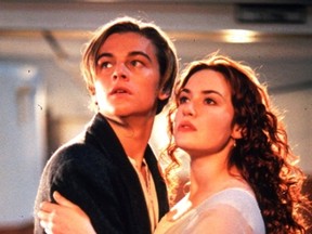 Jack (Leonardo DiCaprio) and Rose (Kate Winslet) are stunned at the sight of a huge iceberg as they stand on the Titanic's deck in scene from James Cameron's Titanic. (Photo, handout).