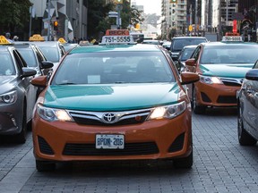 Taxis sit parked outside Union Station on Aug. 8, 2016. (CRAIG ROBERTSON/TORONTO SUN)