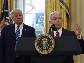 In this February 2017 file photo, President Donald Trump listens as Attorney General Jeff Sessions speaks at the White House. (AP PHOTO)