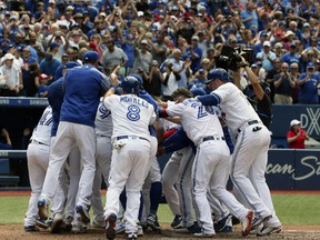 Steve Pearce of the Toronto Blue Jays homers to left field to defeat the Oakland A's at the Rogers Centre on July 27, 2017. (Veronica Henri/Toronto Sun/Postmedia Network)