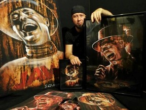 Kingston artist Shane Goudreau with some of his paintings of The Tragically Hip. (Supplied photo)