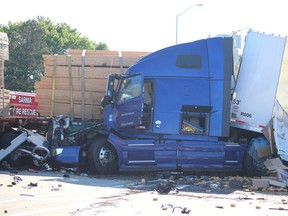 Two separate accidents involving transport trucks occurred on July 19 and July 25 on Highway 402 westbound. This photograph was taken on July 25. (Neil Bowen/Sarnia Observer)