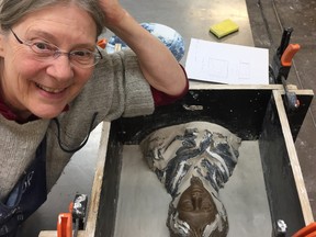 St. Thomas artist Mary Louise White poses with wax model and mould for her glass sculpture, Blanket Stories, produced at the Australian National University glass Workshop where she studied for five months until June. (ANU/CONTRIBUTED)