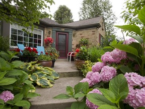 Immaculate gardens like this one at 481 Victoria St. in London invite photographers, not insects. (MIKE HENSEN, The London Free Press)