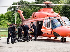 A patient arrives by ORNGE air ambulance at Sunnybrook hospital following a fatal crash on Hwy. 48 on Thursday, July 27, 2017. (VICTOR BIRO/PHOTO)