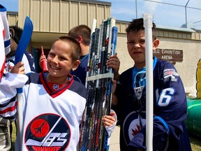 Sticks broken by Winnipeg Jets and Manitoba Moose players have been repaired and refurbished are being given to inner-city youth players. (Scott Billeck/Winnipeg Sun)