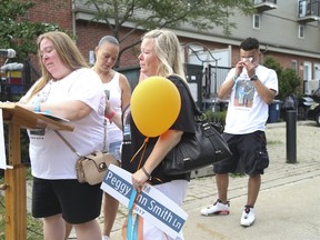 Family members, friends, community members and politicians gathered to honour the memory of Peggy Ann Smith on Thursday, July 27, 2017. Smith was senselessly gunned down last summer. Peggy Ann Smith Lane was unveiled Thursday. (JACK BOLAND/TORONTO SUN)