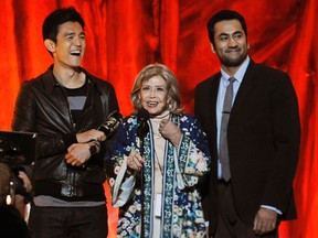 In this Oct. 15, 2011 file photo, actors John Cho, left, and Kal Penn, right, flank voice artist June Foray as she accepts the Comic-Con Icon award at the 2011 Scream Awards, in Los Angeles. Foray's niece, Robin Thaler, said Thursday, July 27, 2017, that Foray died at Wednesday in a Los Angeles hospital of cardiac arrest. She was 99. (AP Photo/Chris Pizzello, File)