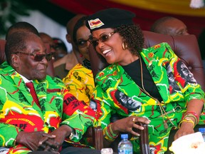 In this Friday June, 2, 2017 photo, Zimbabwe President Robert Mugabe and his wife Grace attend a youth rally in Marondera, about 100 km east of Harare. Zimbabwe's 93 year old president is ditching the old for the young as he makes a pitch for a fresh five year term ahead of next year's election. (AP Photo/Tsvangirayi Mukwazhi)