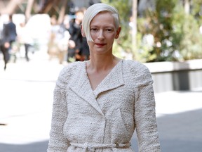 Tilda Swinton poses during the photocall before Chanel 2017-2018 fall/winter Haute Couture collection show in Paris on July 4, 2017. / AFP PHOTO / Patrick KOVARIK (Photo credit should read PATRICK KOVARIK/AFP/Getty Images)