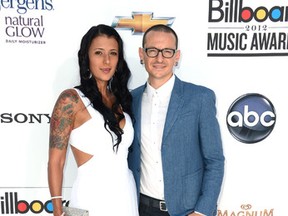 Musician Chester Bennington of Linkin Park (R) and wife Talinda Ann Bentley (L) arrive at the 2012 Billboard Music Awards held at the MGM Grand Garden Arena on May 20, 2012 in Las Vegas, Nevada. (Photo by Frazer Harrison/Getty Images for ABC)
