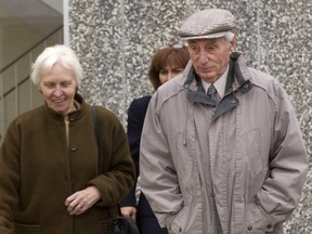 Helmut Oberlander (right) and his wife Margret (left) and daughter Irene Rooney (centre behind) leave the courthouse in Kitchener, Ontario on Tue., Nov. 4, 2003. Oberlander, 79, was found by a Federal Court of Canada judge in 2000 to have obtained his citizenship fraudulently by failing to disclose his service with a notorious Nazi killing unit when he came to Canada from Germany in the early 1950s. (CP PHOTO/Waterloo Regional Record-Peter Lee)