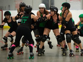 Members of the E-Ville roller Derby league practice at the Edmonton Sports Dome, 10104 32 Ave., in Edmonton Thursday July 20, 2017. David Bloom/Postmedia