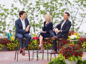 Prime Minister Justin Trudeau, left, speaks with Kelly Ripa, centre, and Ryan Seacrest during his appearance on Live with Kelly and Ryan in Niagara Falls, Ontario on Monday, June 5, 2017. THE CANADIAN PRESS/Aaron Lynett