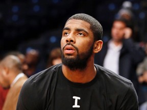 Cleveland Cavaliers guard Kyrie Irving warms up before an NBA basketball game against the Brooklyn Nets at the Barclays Center on Dec. 8, 2014. (AP Photo/Kathy Willens)