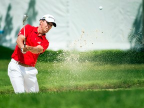 Mike Weir of Bright's Grove hits out of a bunker on the first hole during the RBC Canadian Open at Glen Abbey  in Oakville, Ont., on Friday, July 28, 2017. (NATHAN DENETTE/The Canadian Press)