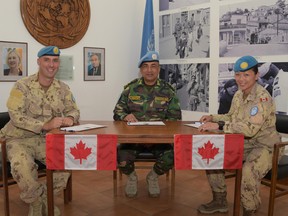 Capt. Soo Kyong Choi, right, an RMC graduate, last week assumed command of Canada's Operation Snowgoose, the Canadian Forces' support of the United Nations mandate in Cyprus. (Submitted photo)