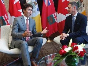 Prime Minister Justin Trudeau meets with Winnipeg mayor Brian Bowman at City Hall in Winnipeg, Friday, July 28, 2017. THE CANADIAN PRESS/John Woods
