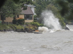 Monday's torrential downpour, during which approximately 100 millimetres of rain fell in a 14-hour period, caused storm sewers to overflow and basements to flood in neighbourhoods across the city. (Julia McKay/The Whig-Standard)