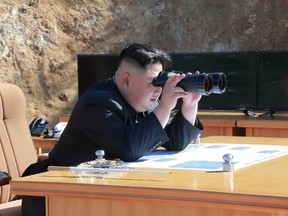This picture taken and released on July 4, 2017 by North Korea's official Korean Central News Agency (KCNA) shows North Korean leader Kim Jong Un inspecting the test-fire of intercontinental ballistic missile Hwasong-14 at an undisclosed location. (STR/AFP/Getty Images)