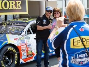 NASCAR race car driver Alex Tagliani takes a photo with fans while making an appearance at the Lowe's store at 9603 165 Ave., in Edmonton Friday July 28, 2017. David Bloom/Postmedia