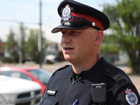 Const, Jeff Eichmann, with the Edmonton police southeast division neighbourhood foot patrol, offers advice for reducing property crimes including thefts from vehicles and break and enters into garages at a media availability on Thursday, July 27, 2017 in Edmonton, Alta. CLAIRE THEOBALD/POSTMEDIA