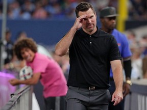 TFC head coach Greg Vanney salutes the crowd after being ejected two weeks ago in New York. (THE ASSOCIATED PRESS)