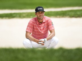 Graham DeLaet, of Canada, looks out from the bunker on the 13th hole during the Canadian Open golf tournament at Glen Abbey golf club, in Oakville, Ont., on Saturday, July 29, 2017. (THE CANADIAN PRESS/Nathan Denette)