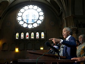 Rev. Al Sharpton, stands with area clergy and responds to a question during a news conference Thursday, July 13, 2017, in Chicago. (AP Photo/Charles Rex Arbogast)