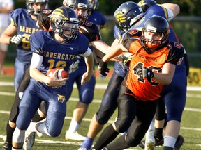 Peterborough Wolverines Chase Mitchell runs after Sault Sabrecats Ryan Yost during Ontario Football Conference North Division final action on Saturday July 29, 2017 at Thomas A. Stewart Athletic Field in Peterborough, Ont. (CLIFFORD SKARSTEDT/PETERBOROUGH EXAMINER/POSTMEDIA NETWORK)