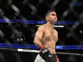 Ricardo Lamas (right) reacts after defeating Jason Knight during their featherweight bout at UFC 214 at Honda Center in Anaheim last night. (Getty Images)