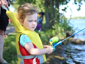 Hannah Vallieres, 2, keeps a watchful eye on her bobber during the Blair Smith Memorial Fishing With Kids event on Saturday July 29, 2017 in Trenton, Ont. Tim Miller/Belleville Intelligencer/Postmedia Network