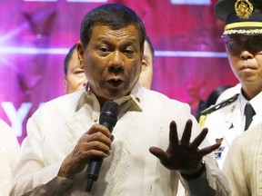 Philippine President Rodrigo Duterte addresses protesters following his state of the nation address outside the Lower House in Quezon city, Philippines on July 24, 2017. Philippine police fatally shot a city mayor who was among the politicians the president publicly linked to illegal drugs and many others in gunbattles that erupted Sunday, July 30, in the south, police said. (Bullit Marquez/AP Photo/Files)