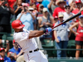 Texas Rangers’ Adrian Beltre records his 3,000th career hit, which came off Baltimore Orioles starter Wade Miley in the fourth inning Sunday, July 30, 2017, in Arlington. (AP Photo/Tony Gutierrez)