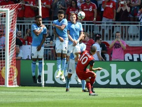Toronto FC’s Sebastian Giovinco scores on a free kick against New York City FC during the second half of yesterday’s game at BMO Field. (THE CANADIAN PRESS)