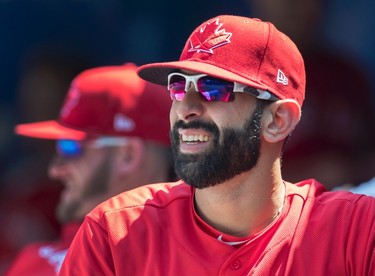 Toronto Blue Jays' Jose Bautista watches the game between the Jays and Los Angeles Angels from the bench, in Toronto on Sunday, July 30, 2017. With the MLB trade deadline tomorrow there is speculation that he may be moved. THE CANADIAN PRESS/Fred Thornhill ORG XMIT: FJT128